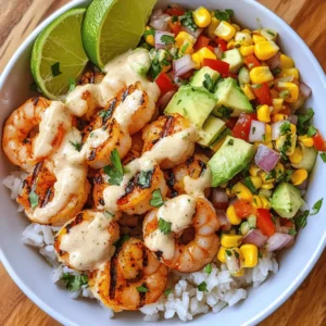If you're looking for a delightful dish that combines fresh ingredients with vibrant flavors, look no further than the Grilled Shrimp Bowl with Avocado, Corn Salsa, and Creamy Garlic Sauce. This dish not only satisfies the taste buds but also provides a hearty meal that is visually appealing and packed with nutrition. The succulent grilled shrimp, paired with the crunchy corn salsa and creamy garlic sauce, creates a symphony of textures and flavors that will leave your palate craving more.
