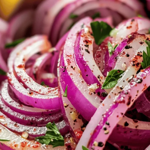 Zesty Sumac Onions are a delightful and vibrant dish that can elevate a wide range of meals with their unique flavor profile and eye-catching presentation. This dish showcases the refreshing bite of red onions, balanced by the tangy notes of sumac and fresh lemon juice, making it a perfect accompaniment to grilled meats, salads, or even as a stand-alone topping. What sets this recipe apart is not just its vibrant flavors, but also the simplicity of its preparation, allowing the fresh ingredients to shine through.